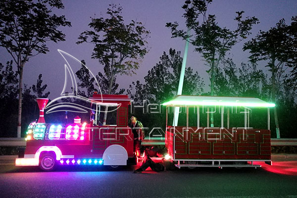 Holiday Lighted Train Through an Amusement Park